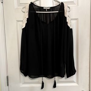leshop black sheer top with shoulder cutouts featuring white crochet detail.
